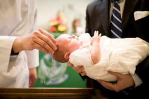 Priest Baptizing Infant